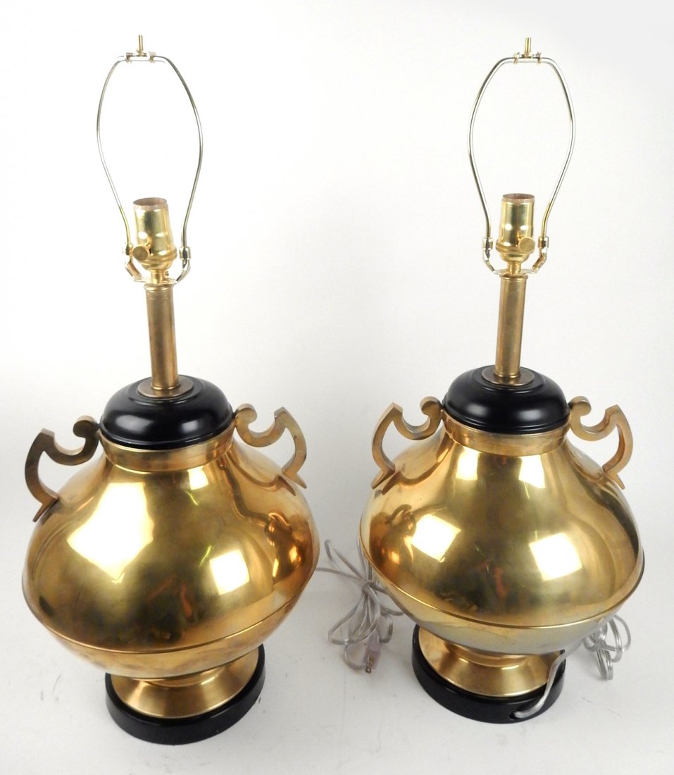 Pair of 1950's Brass Table Lamps: Classical-style urn-form bronze lamp with handles on black aluminum base. [12 1/4" Dia x 21 1/2" H]. Good condition. From Retro Modern 20th Century Lighting. From Retro Modern 20th Century Lighting.