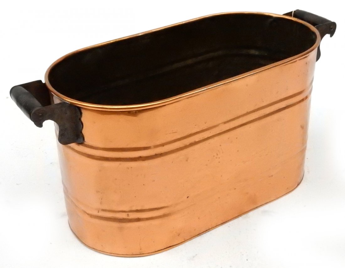 Copper Pot: Copper ice bucket with wood handles. [26 3/4" W x 12" D x 13" H]. Some dents.