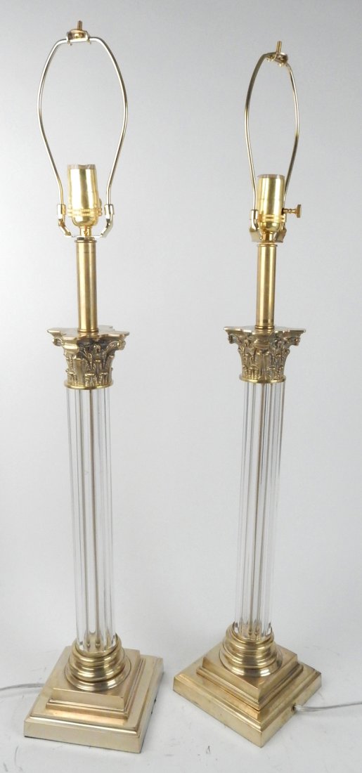 Pair of Glass Column Table Lamps: Brass, stepped square base. Glass doric column with brass capitol. From Retro Modern 20th Century Lighting.