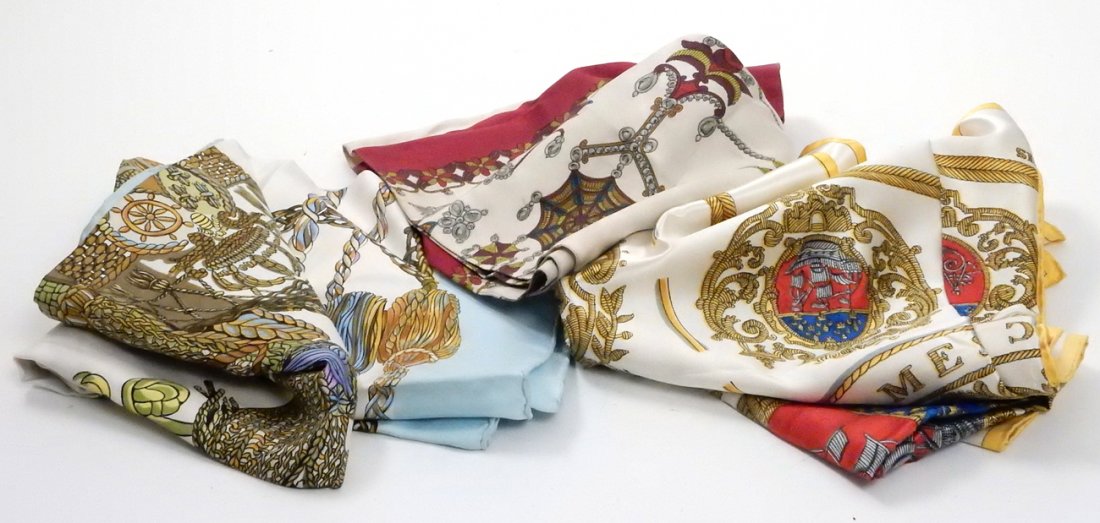 Hermes, Two Scarves and Shawl: Comprises: 1.) Silk "Le Timbalier" scarf. Labeled within print "Hermes Paris". [34" x 34"]. Light soiling, some stains. 2.) Silk "Les Armes de Paris" scarf. Labeled within print "Hermes Paris". [34" x