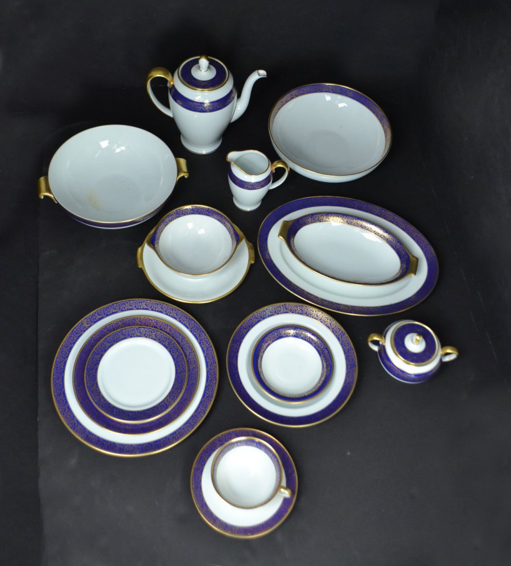 Rosenthal Dinnerware: Rosenthal china service for twelve. White with cobalt blue border and gilt decoration. 80 pieces. [10" Dia.]. Very good condition.