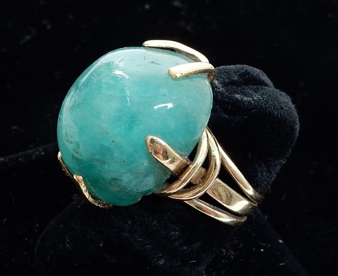 14k Gold Emerald Cabochon Solitaire: Yellow gold lady's solitaire ring with large emerald cabochon. [Approximately 7/8" W x 5/8" D x 1/2" H].