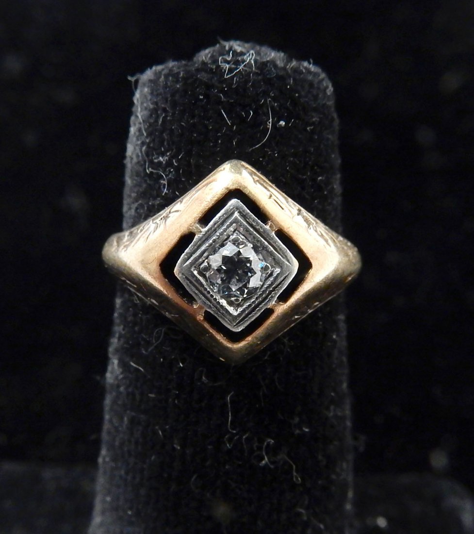 14k Gold Diamond Lady's Solitaire Ring: Antique gold ring with diamond center stone in a pierced setting with engraved band. 1.6 dwt inclusive.