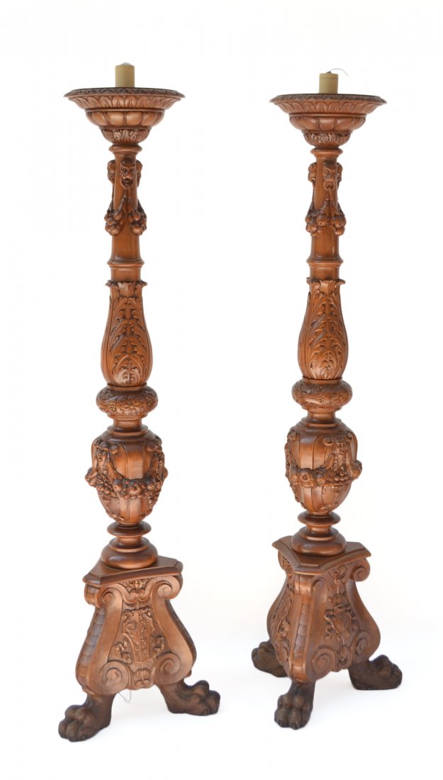 Pr Renaissance Revival Style Torchieres: Robustly carved walnut torchieres with dense ornamentation. Including: acanthus leaves, lion's heads, fruit swags, grotesque masks, shields, and tripod base with lion's paw feet. Each inscribed "Franc