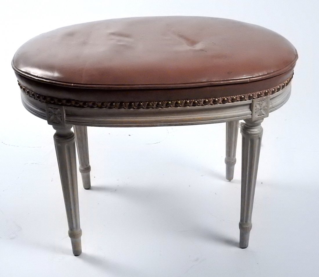 Louis XVI-Style Painted Bench: Oval painted and brown upholstered bench. [23 1/2" W x 15 1/2" D x 17 1/4" H].