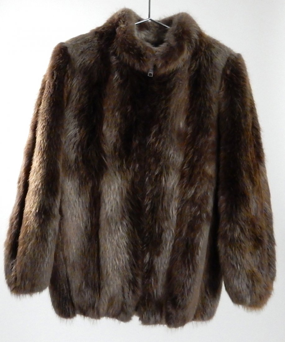 Vintage Women's Raccoon Coat: Woman's 1/2 length raccoon coat with silk lining. Size 8-10. Good condition.