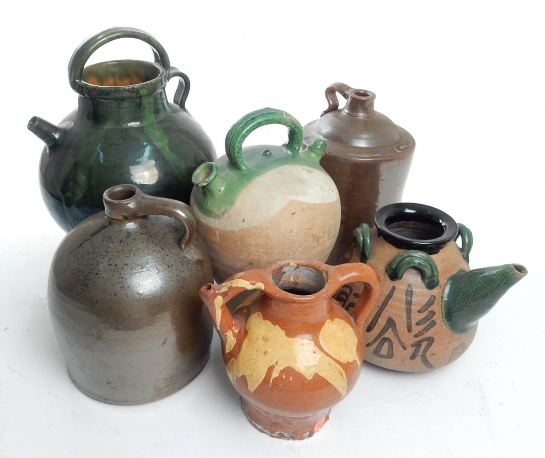 Six Earthenware Handled and Spouted Jugs: Six earthenware and handled spouted jugs. [Largest: 10 1/2" Dia x 14"]. Condition varies, lot sold "as is".