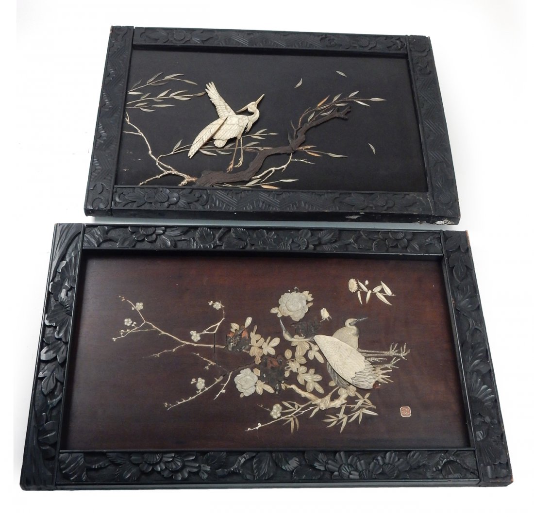 Two Asian Carved Wood and Bone Panels: Two hanging panels depicting birds in floral setting. One stamped lower left. Both encased in ebonized wood frames. [Panel 1: 13 3/4" W x 25 1/2" H; Frame: 18" W x 29 7/8" H; Panel 2: 14 1/2" W x 23 1