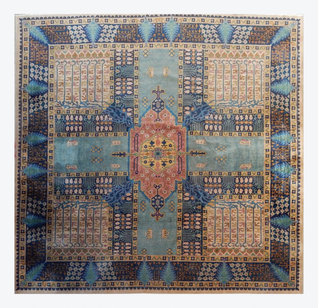 Geometric Decorated Rug: Geometric decorated rug, featuring central cross pattern. [119" x 120"]. Red stain mark on central border. Furniture leg imprint mark in upper right quadrant.