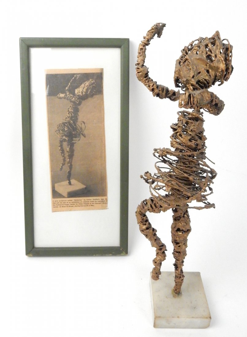 Esther Goldfarb "Just for Fun" Sculpture: Wire sculpture, "Ballerina" by Esther Goldfarb, together with a framed newspaper print. [12" H].