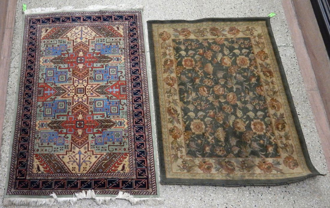 Two 20th Century Rugs: Comprises: 1.) Oriental rug. [72" W x 48" H]. 2.) Machine-made rug. [61 1/2" W x 45 1/2" H]. Stains and candle wax.