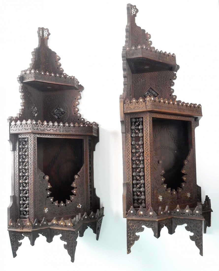 19th C. Moroccan Hanging Cabinets: Pair of antique ornate wood incised and mother-of-pearl inlaid hanging cabinets. One "as is" (lower moldings).