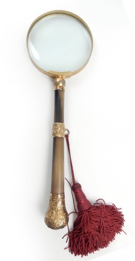 Gilt Brass Magnifying Glass: Gilt brass magnifying glass. [Overall: 13" L; Glass: 4" dia].