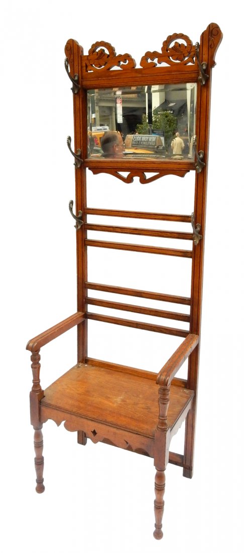 Victorian Hall Chair: 19th century Victorian oak hall/coat rack with a beveled mirror top panel. [24" L x 17" D x 75 1/2" H].