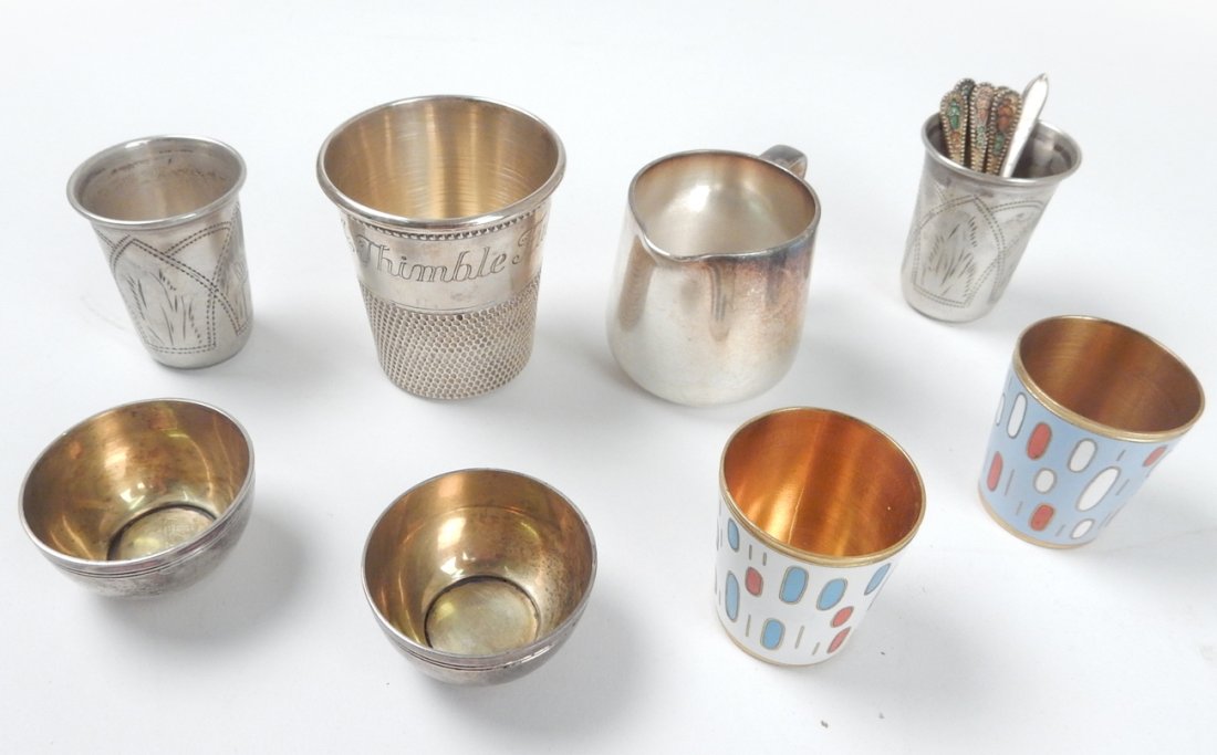 Lot of 13, Assorted Group of Silver: Comprises: Two sterling salts with gold wash, Tiffany and Co. Makers [1 3/8" Dia]; Sterling Jigger, inscribed "Only a Thimble Full", [2" H]; two Russian silver cups; five spoons with two enameled cups