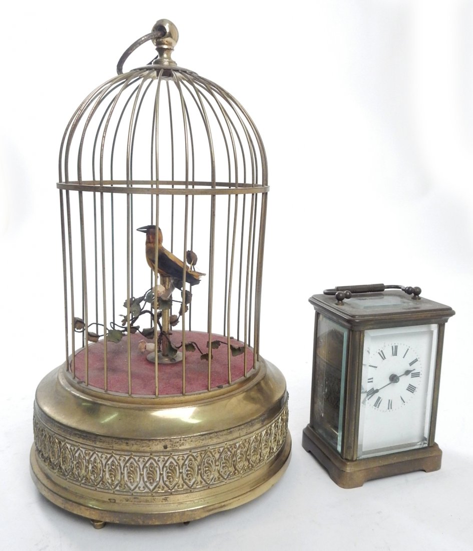 Carriage Clock and Automaton Bird: Comprises: 1.) French carriage clock, [4 1/2" H]. Chipped glaze. Automaton, bird in cage, from Germany. [11 1/4" H]. Missing tail feathers. Lot sold "as is".