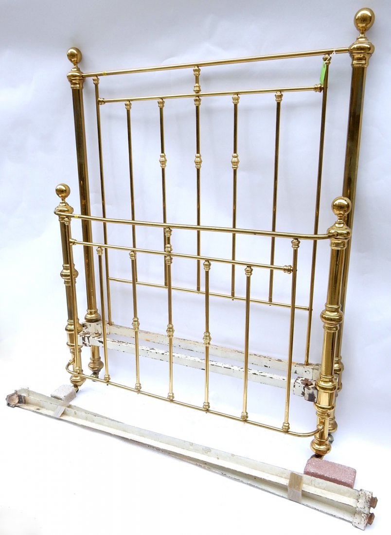 19th Century Victorian Brass Bed: Brass headboard and footboard with metal support rods. [Headboard: 54" x 3 1/2" x 67 3/4"]. Oxidation to brass in various spots, some scratches.
