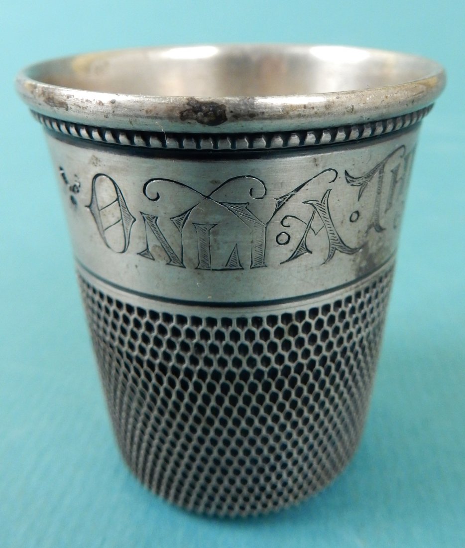 Sterling Silver Jigger: Sterling silver jigger in the shape of a large thimble. Inscribed "Only a Thimble Full". 1.155 ozt. [2 7/8" Dia. x 1 7/8" H]. In good condition.