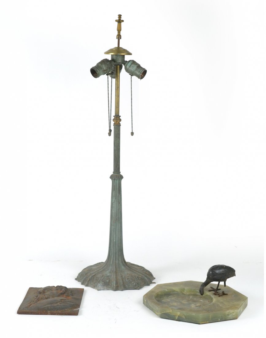 Lamp Base, Onyx Tray, & Metal Plaque: Bronze table lamp base only, a raised male iron plaque and a figural onyx ash tray. Very worn, sold "as is". From the collection of Spencertown Art & Antique Company.