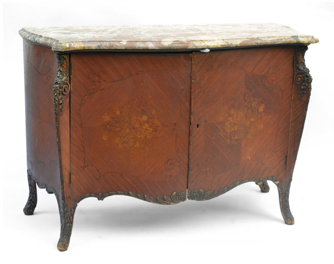 Louis XV Style Marble Top Commode: Bow front bedroom commode with two doors concealing four drawers. Features floral marquetry throughout. [52" W x 23 1/8" D x 36" H]. Wear with some chips.