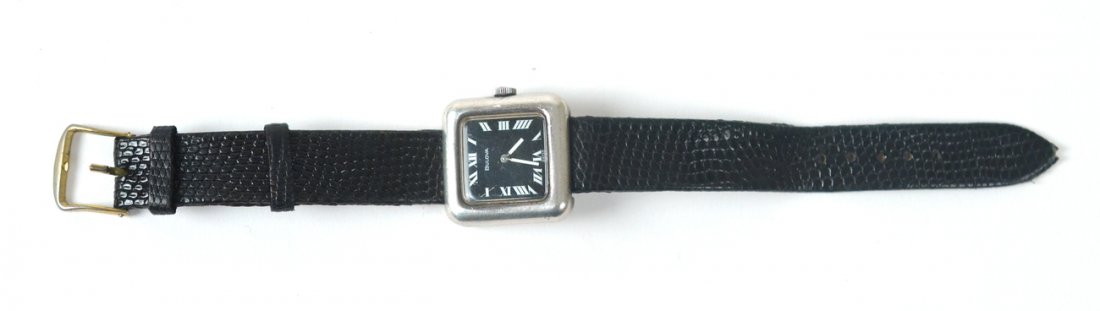Sterling Silver Bulova Wrist Watch: Bulova manual wind wrist watch. Sterling silver rim with black leather band. Untested. Light wear to band, light scratches to face.