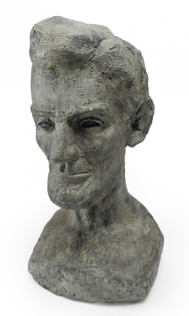 Plaster Bust of Abraham Lincoln: Bears faux bronze patina. [10 1/2" W x 12" D x 20 1/4" H]. Chips throughout. Deep crack and previous repair to neck where attached to head. From the collection of Spencertown Art & Antique Company.