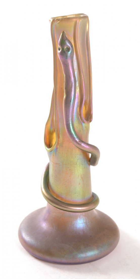 Vintage Loetz/Tiffany Iridescent Vase: Iridescent art glass vase with three holes along neck in addition to top. Features a trailed glass snake wrapped around side. Unmarked on polished pontil kick [4" dia x 8 1/2" H]. Complete.