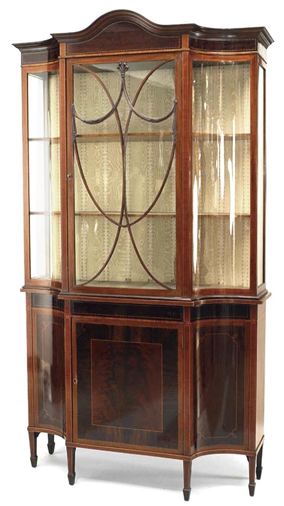 19th C. Sheraton-Style Mahogany Cabinet: English Sheraton-style mahogany cabinet with shield shaped lattice door and curved glass sides. [42" W x 15" D x 78" H].