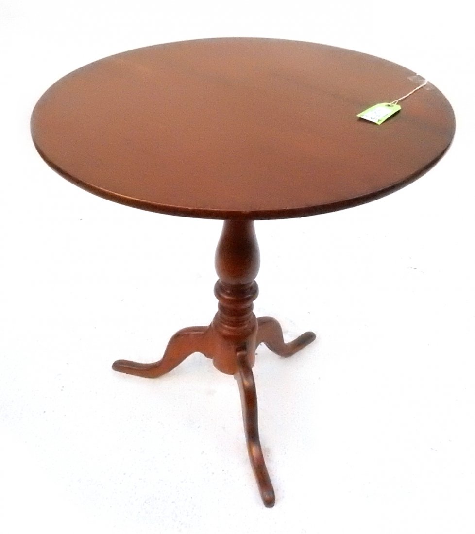 Queen Anne-Style Tilt Table: Mahogany tilt table with a birdcage mechanism. [27 1/4" Dia x 27 1/2" H; tilted: 43" H]. From Martin Parker / Spencertown Art and Antique Company.