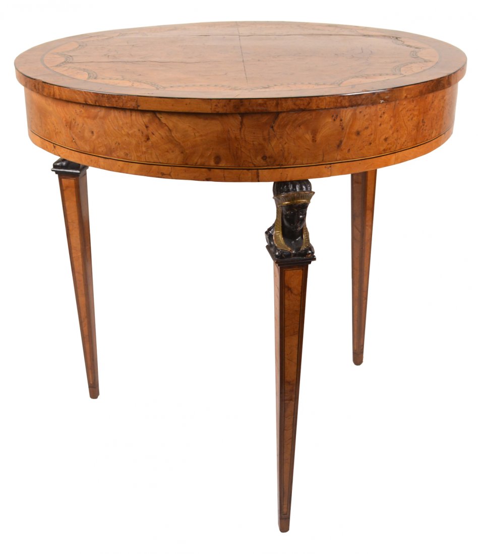 18th/19th C. Bouillotte Table: French walnut bouillotte table with scallop inlay along center of the boarder and Egyptian faces on legs. [28" Dia x 29 1/4"]. Leg splits, otherwise in good condition as with age.