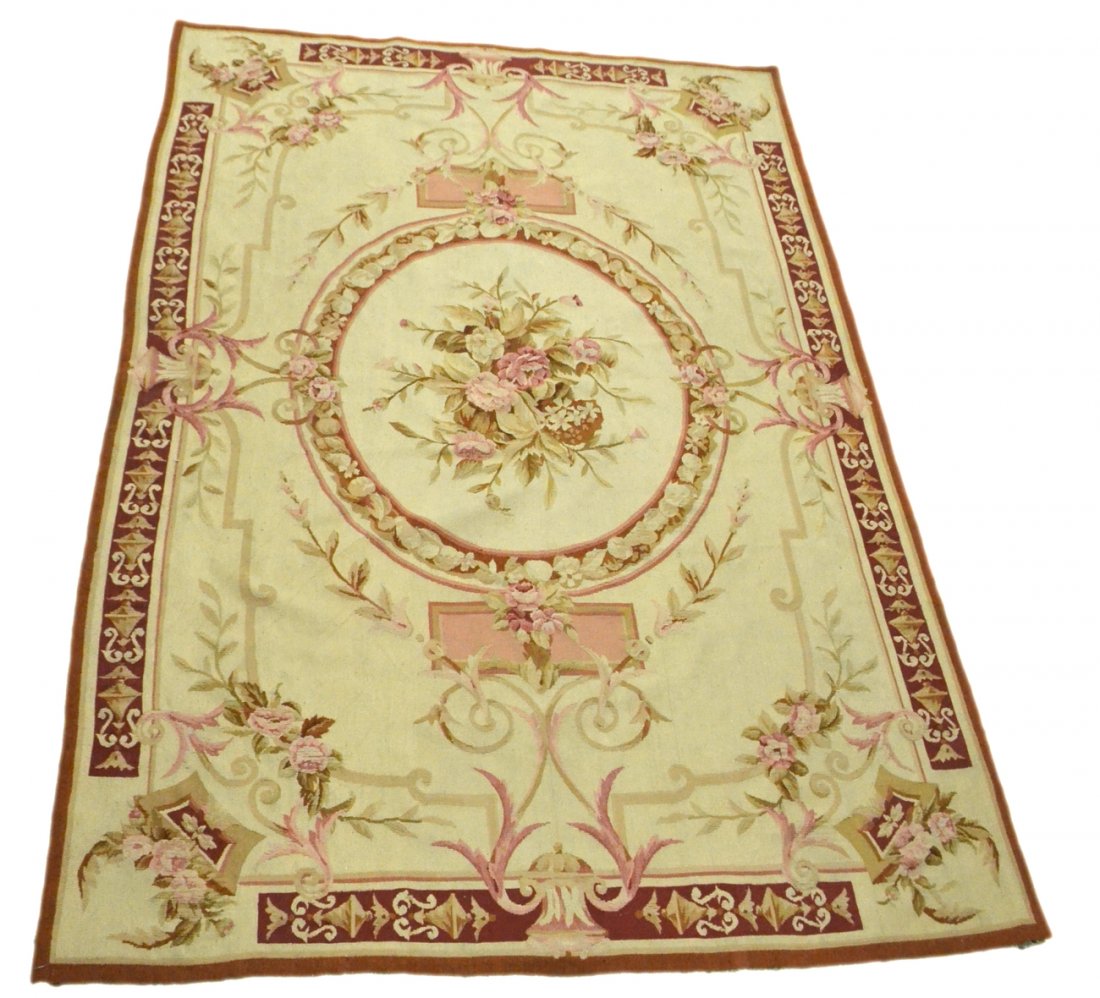 Chinese Aubusson-Style Rug: Wool rug with oval center medallion and floral decor. [105" x 69"]. Some soiling.