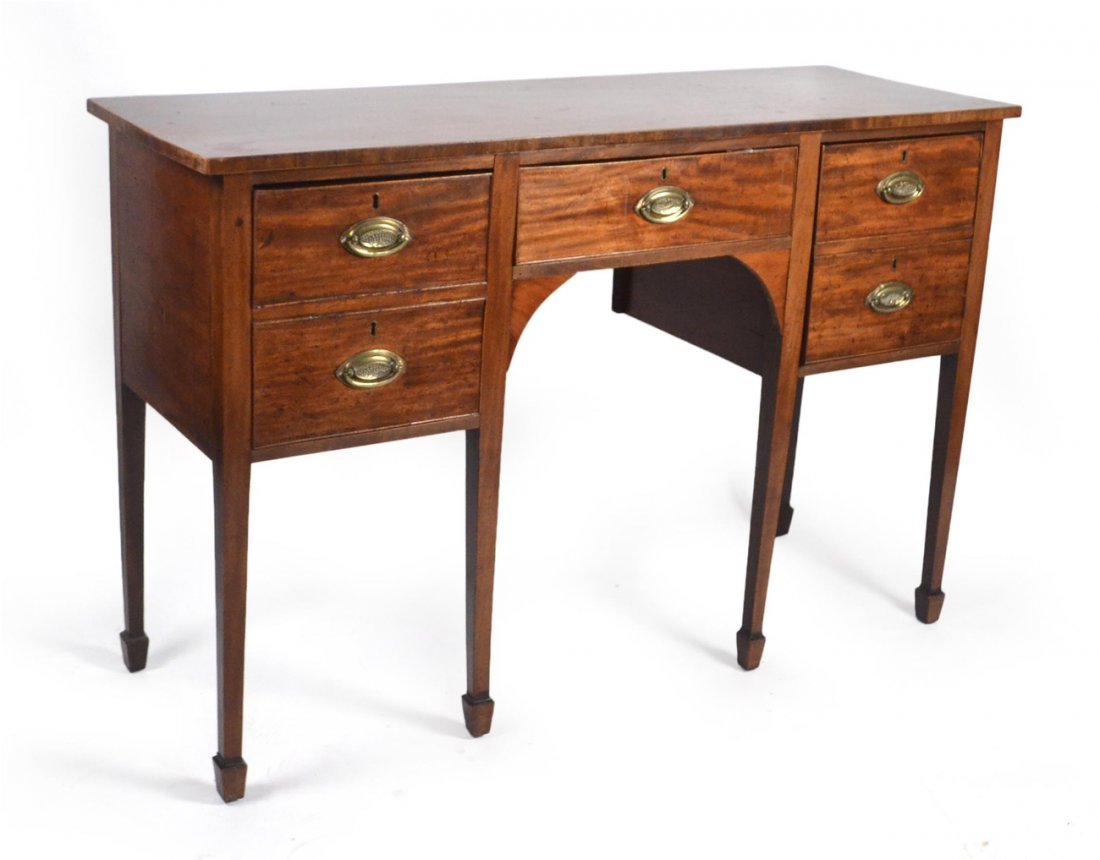 Hepplewhite Mahogany Sideboard: Having one deep drawer, one center drawer, and one door (as two faux drawers), all with brass bales, raised on tapered legs. [56" L x 19 1/2" D x 37" H]. Wear consistent with age and use, otherwise go
