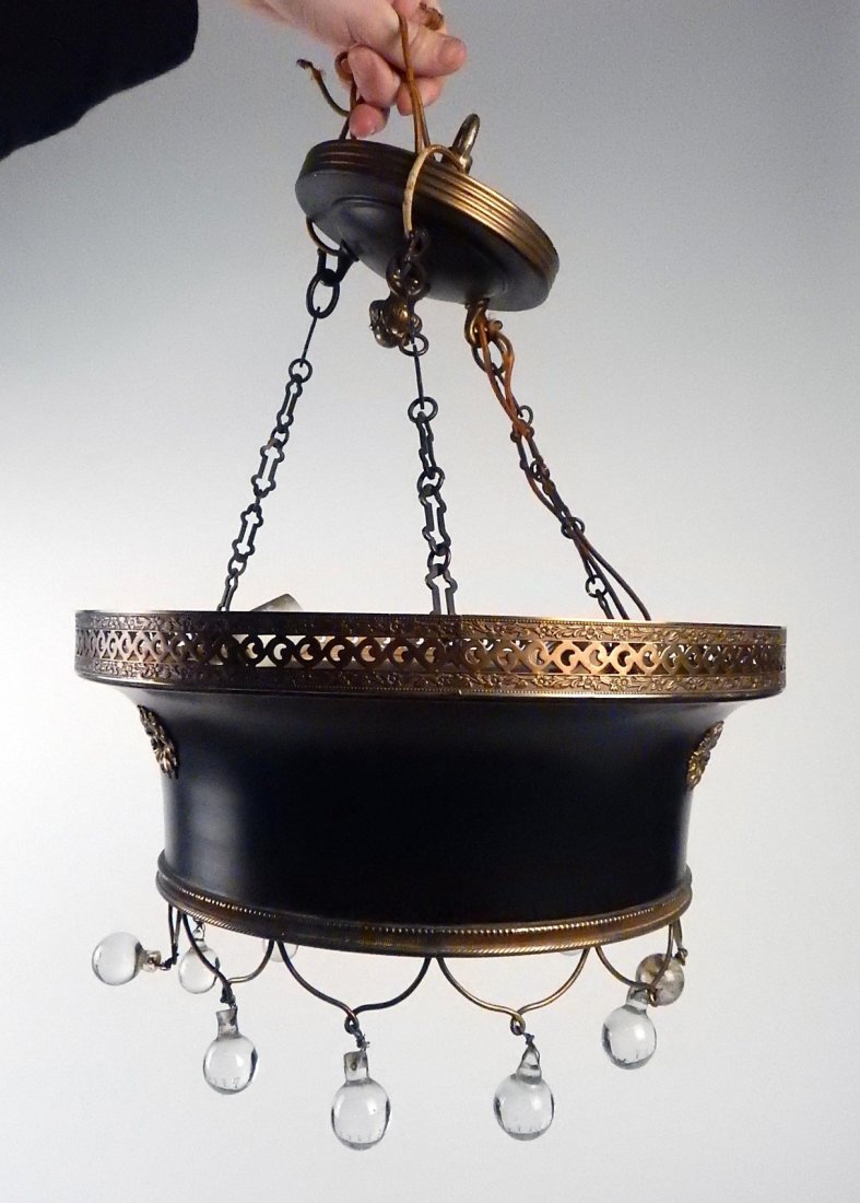 Empire-Style Tole Ceiling Fixture: Circular black painted tole fixture with glass ball prisms, brass accents, and frosted glass underplate. [12" Dia x 15" H]. Sockets need to be replaced.