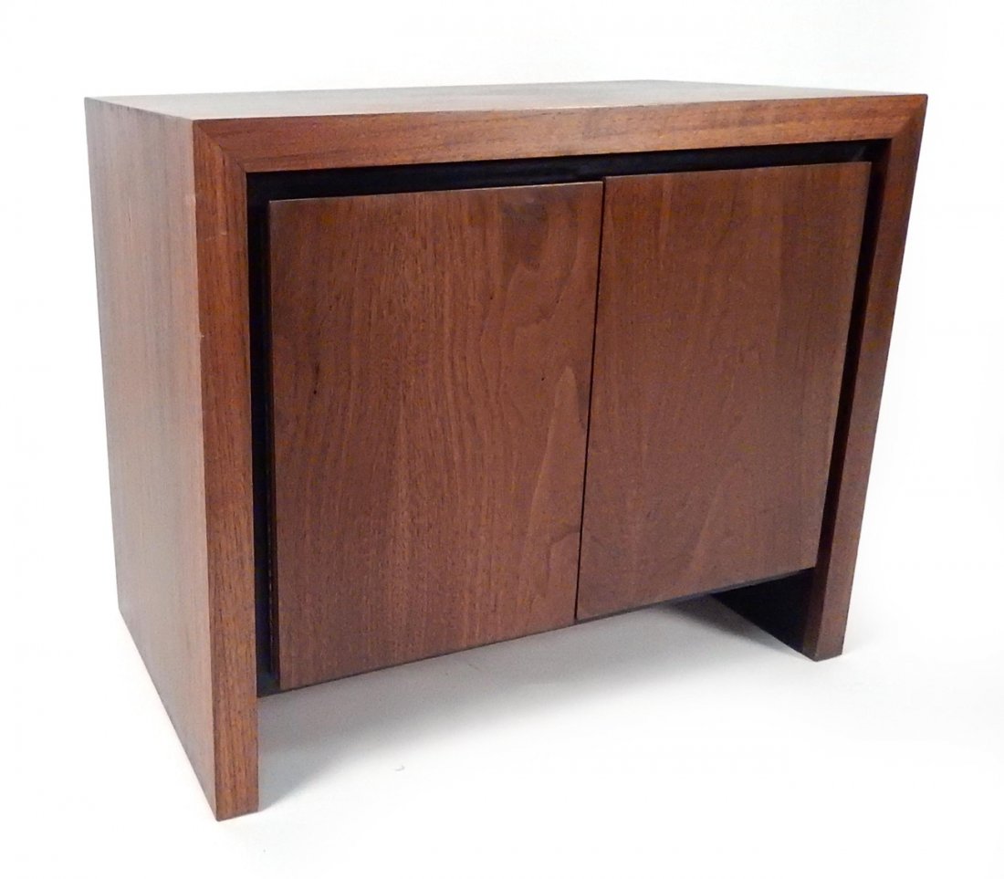 Milo Baughman Walnut Cabinet Table: Bears two doors concealing two shelves. Doors are surrounded by recessed ebonized trim. [27" W x 15 1/2" D x 22 1/2" H]. Some scuffs.