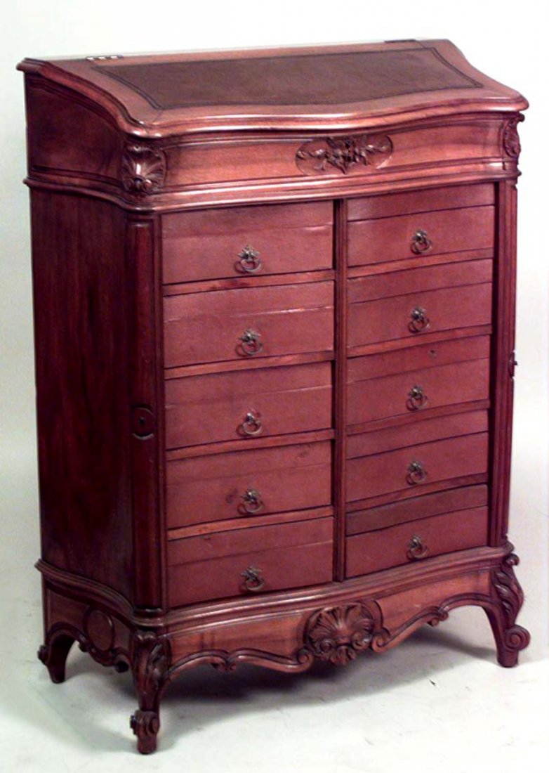 French Provincial-Style Walnut Chest: 19th century French Provincial-style walnut chest with 10 brown leather drawers and slant leather top. [35" W x 17 1/2" D x 47 1/4" H].