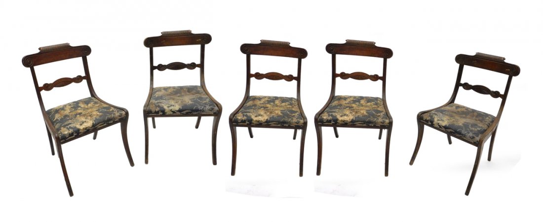 Fire Duncan Phyfe Chairs: Set of five Duncan Phyfe mahogany chairs with upholstered seats. [21 1/2" W x 23" D x 36" H]. Sold "as is".