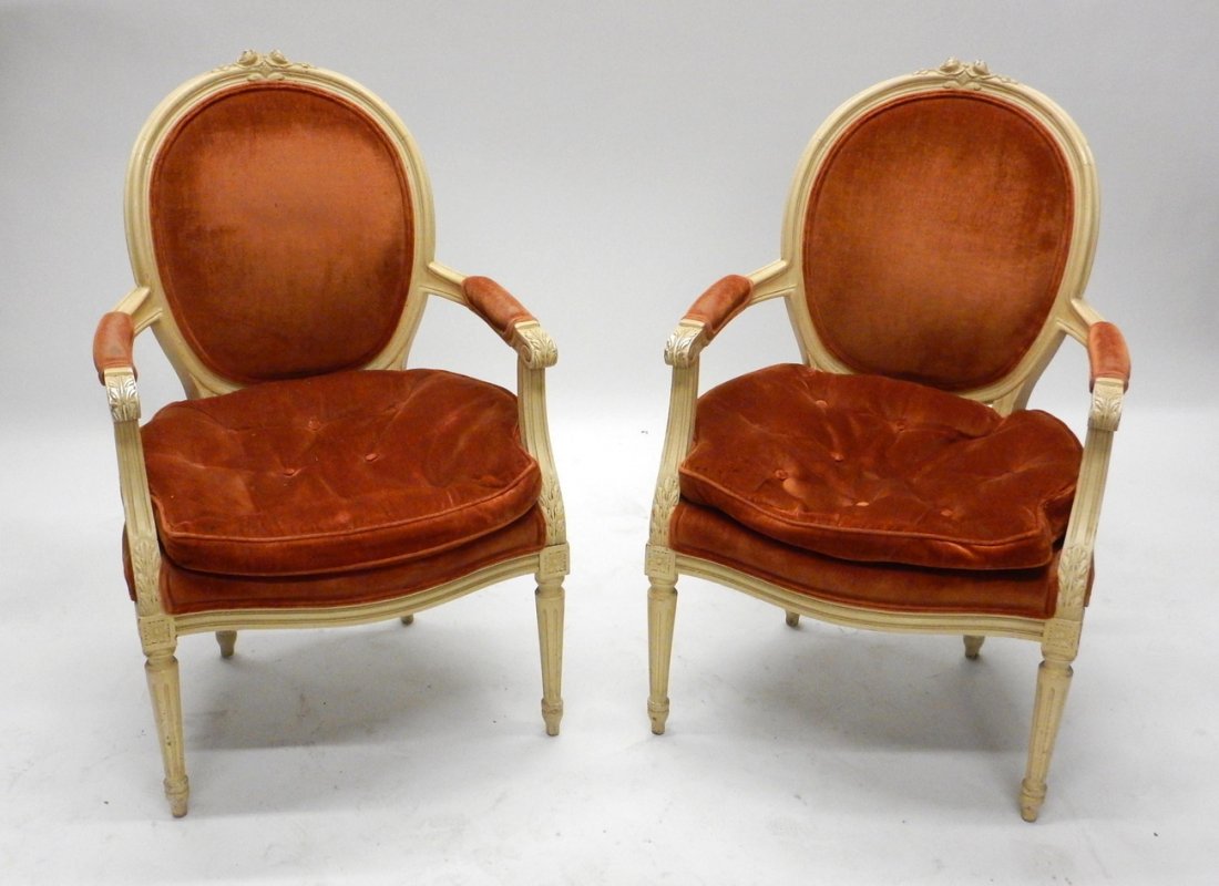 Pair Louis XVI Style Arm Chairs: Pair of Louis XVI style painted creme with velvet upholstery (Meyer Gunther Martini) arm chairs, carved. [22 1/2" W x 18" D x 35 1/2" H]. Good condition.