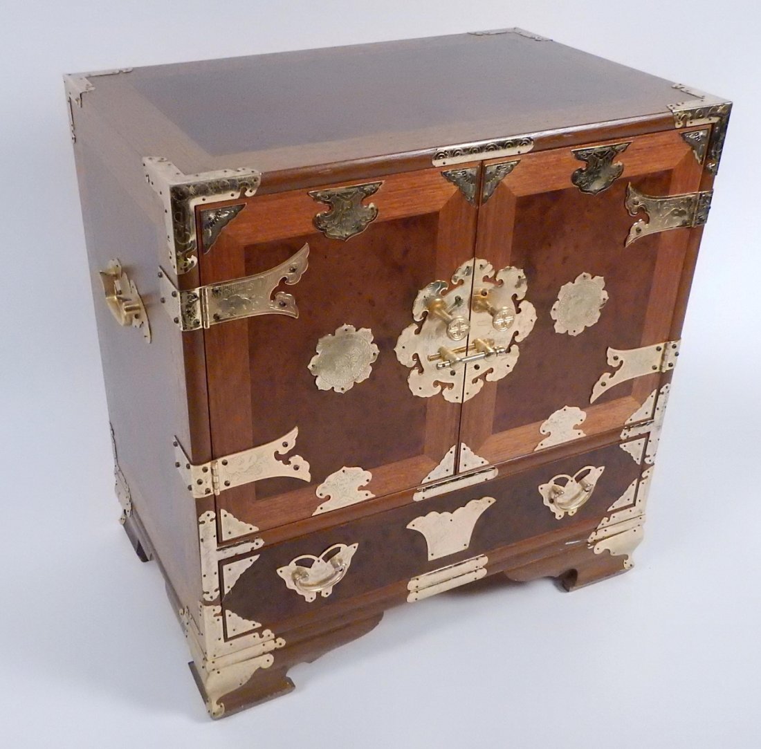 Chinese Campaign Chest: Chinese campaign chest with two doors, one drawer, and brass banded hardware throughout. [21 1/2" W x 14" D x 23" H].