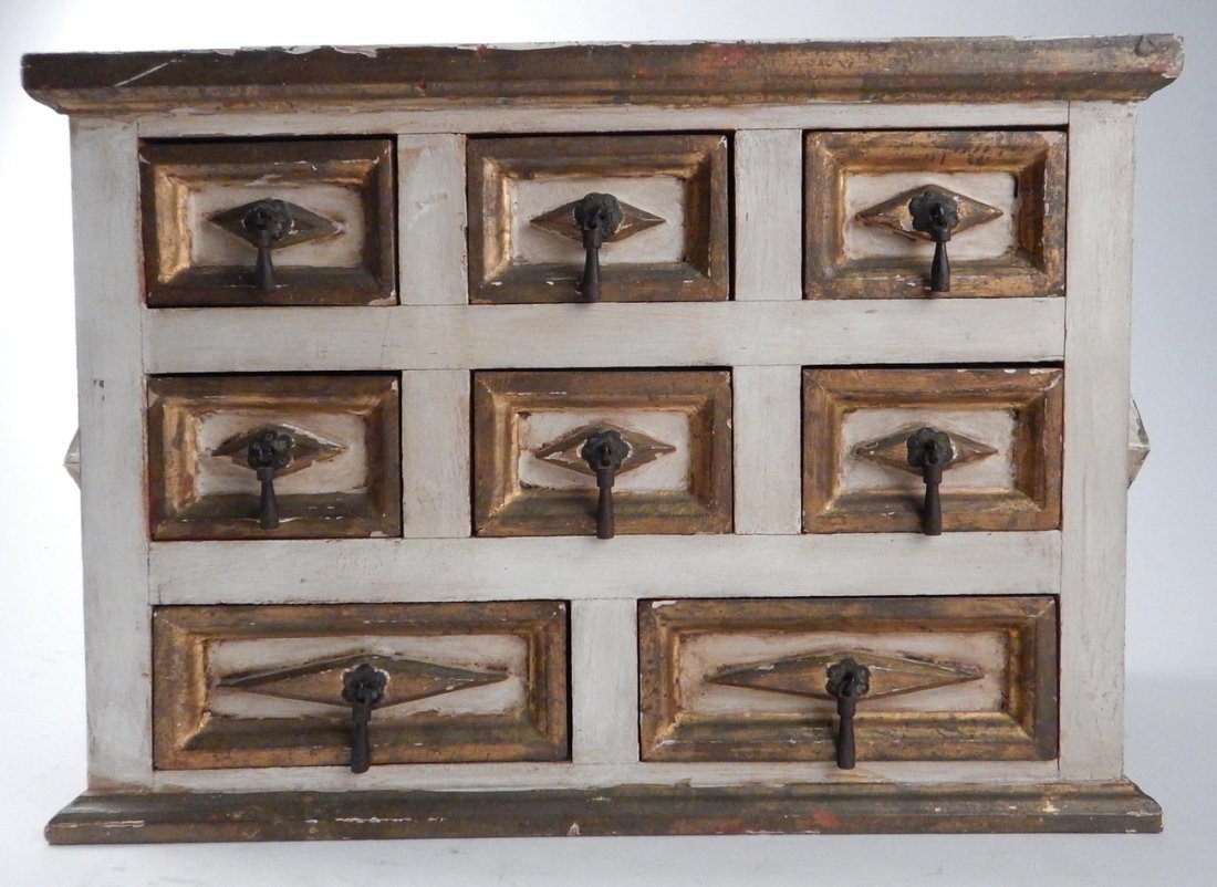 Cream Painted Jewelry Box: Wood gilt and cream painted, eight-drawer box. [15 1/4" x 7 1/4" D x 11 1/4" H]. Having chips, paint losses and splits.
