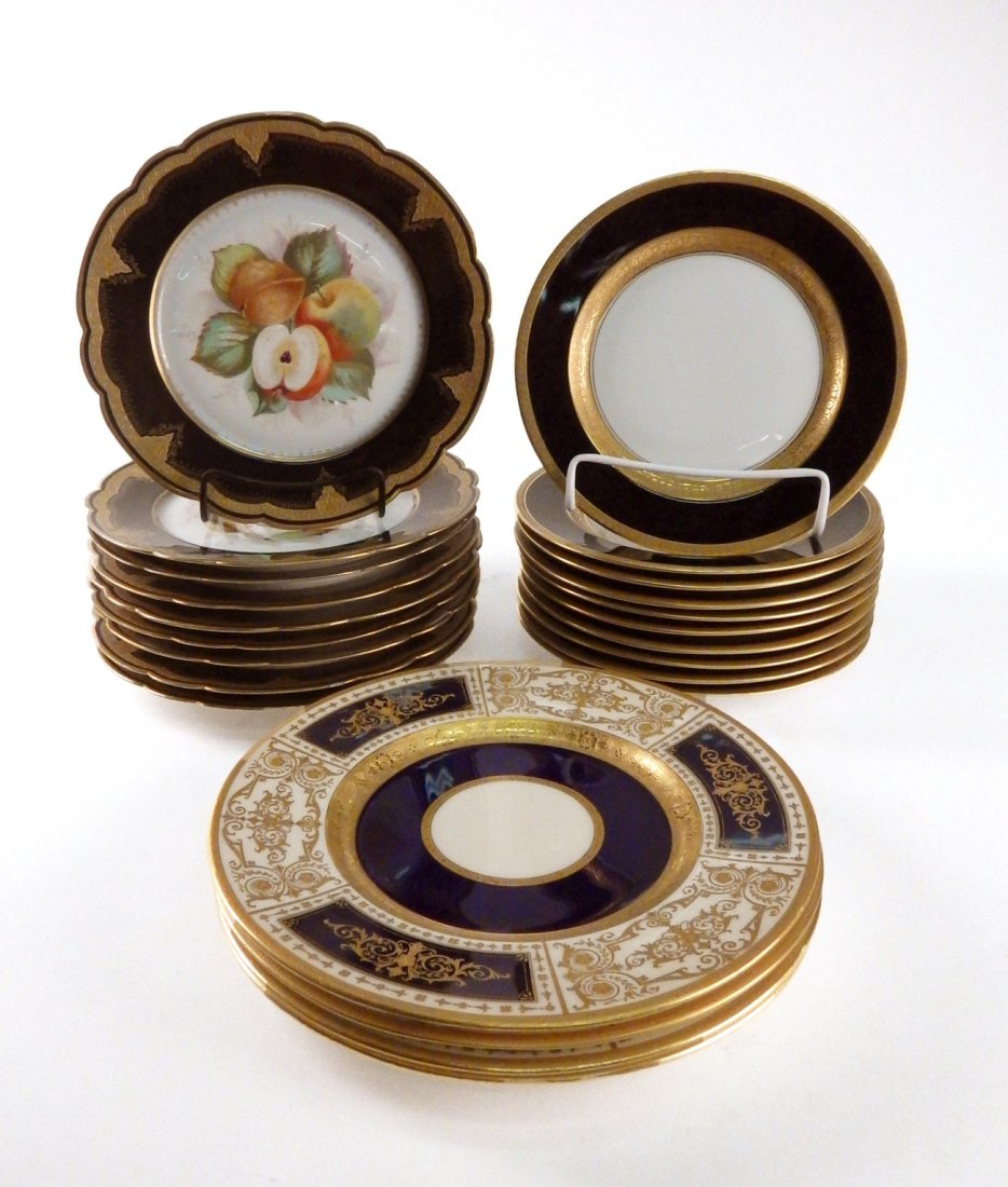 Minton - Rosenthal Plates, 23 Pieces: Partial plates cobalt and gilt including: four Minton plates, ten Rosenthal plates, nine Veritas Vincit plates. [8" - 9" Dia]. One Rosenthal plate repaired at edge, otherwise overall good condition.