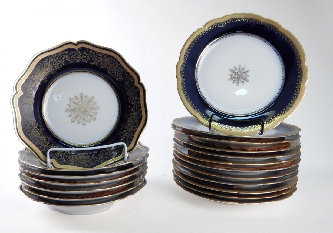 Nineteen Limoges Plates and Bowl: Cobalt blue and gilt decorated partial dinnerware including twelve Limoges dinner plates, seven Limoges soup bowls, 19 pieces total. [9" Dia]. Color worn, edges worn with minor losses.
