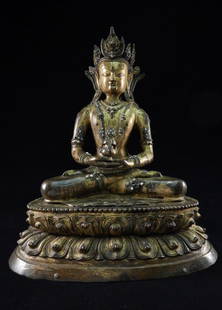 Gilt Bronze Figure of Buddha: Ornate Chinese or Sino-Tibetan gilt bronze figure of Buddha with an elaborate five-point crown. From an estate collection. [14 1/2" W x 10 1/2" D x 17 3/4" H]. Worn patina, missing some accent stones