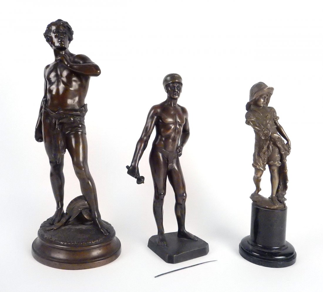 Three Vintage Figural Bronzes: Comprises: 1.) Standing full-length depiction of a warrior with Roman helmut at his feet. Signed on base "P. Kowaczweski". [6 3/8" W x 4 5/8" D x 13 1/8" H]. Proper right hand holds a sword hilt, blad