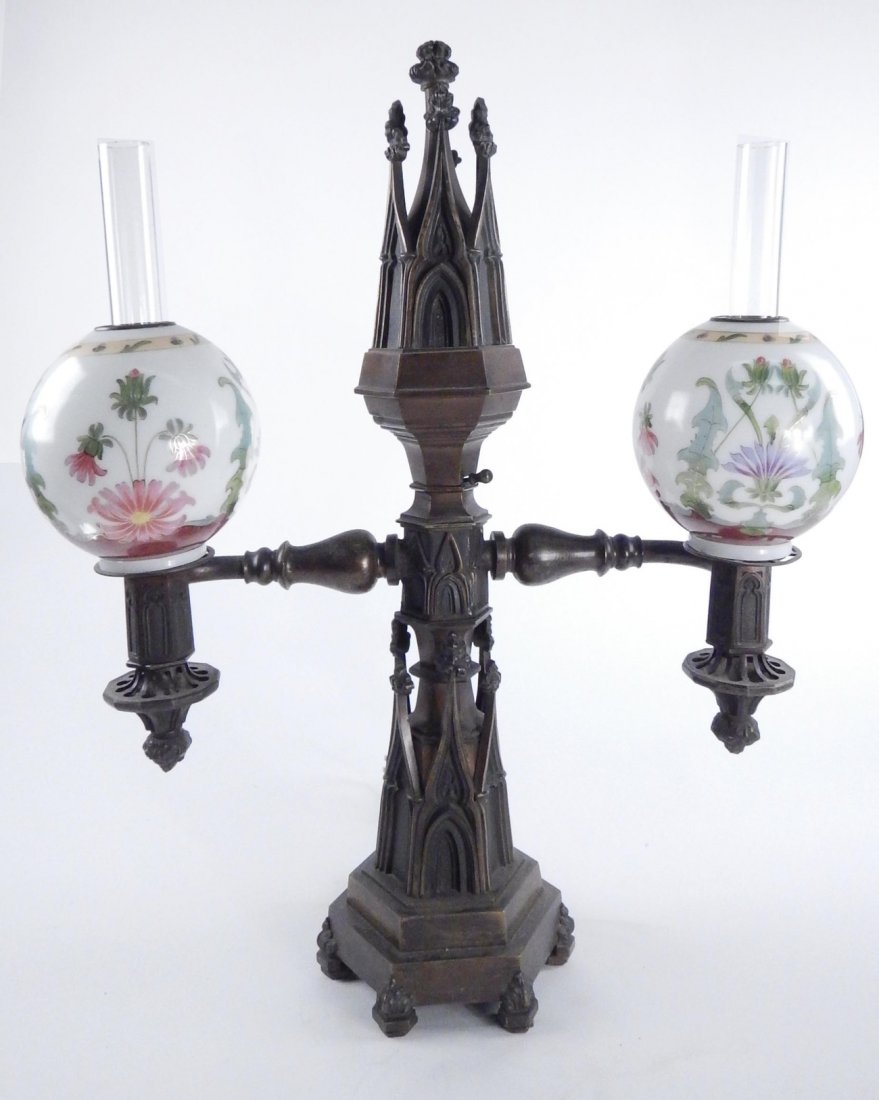 Bronze Gothic Argon Table Lamp: Bronze gothic argon table lamp with two globe-form hand-painted glass shades and glass candle shades. Two-tier tower form base. [21" W x 8" D x 25 1/2" H]. Untested.