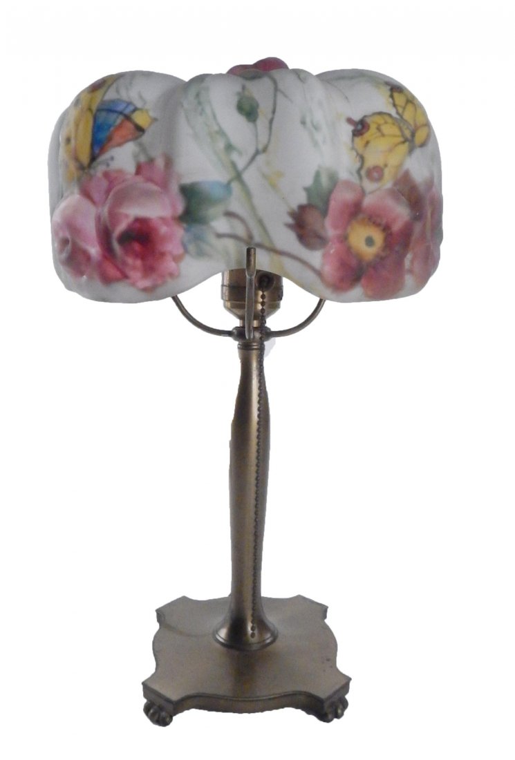 Pairpoint Table Lamp: Brass base with flower and butterfly motif painted shade. [9 1/2" Dia (shade) x 14 1/2" H]. Wear, abrasions to base. Shade overall good condition.