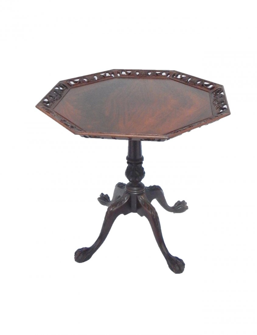 Carved Reticulated Pie Crust Table: Mahogany octagonal top pedestal support table with pierced border and carved claw and ball feet. [30 1/2" Dia x 27 1/4"]. Light wear.