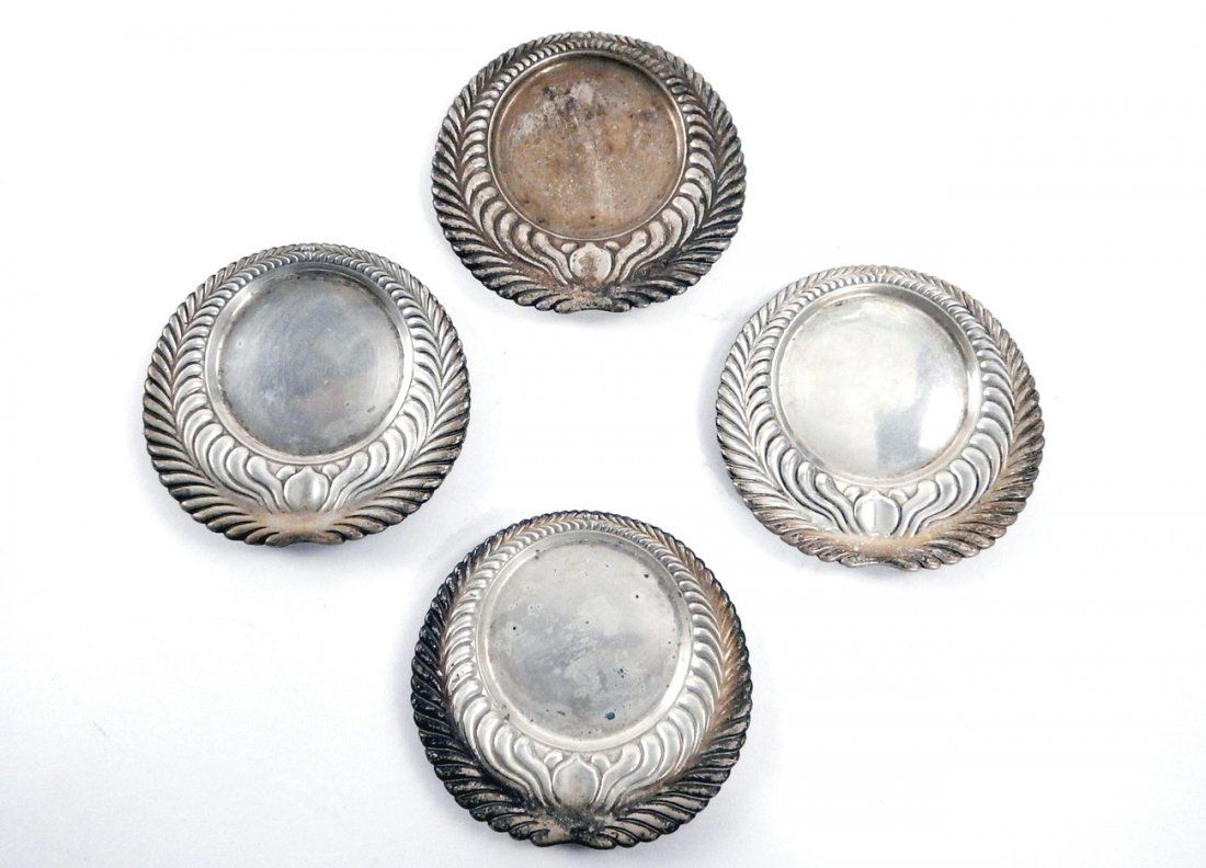 5 Tiffany & Co. Sterling Coasters: 5 sterling Tiffany & Co. coasters with repousse leaf motif. [3 1/2" Dia each]. In good condition. 5.845 ozt.