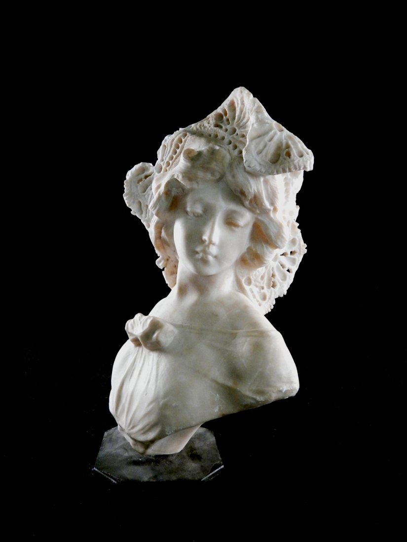 Alabaster Bust of a Woman: In the manner of an 18th century bust of a woman. [10 1/2" W x 7" D x 15" H]. Small chips and abrasions.