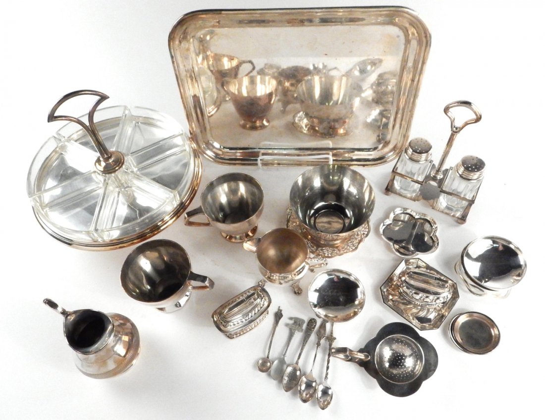 Assorted Silver Plate Items: 20+ silver plate items comprising: condiment stand with 6 glass inserts [9 1/2" H x 10" Dia], salt & pepper shakers with stand, cigarette table lighter, tray, and miscellaneous items. In good conditio