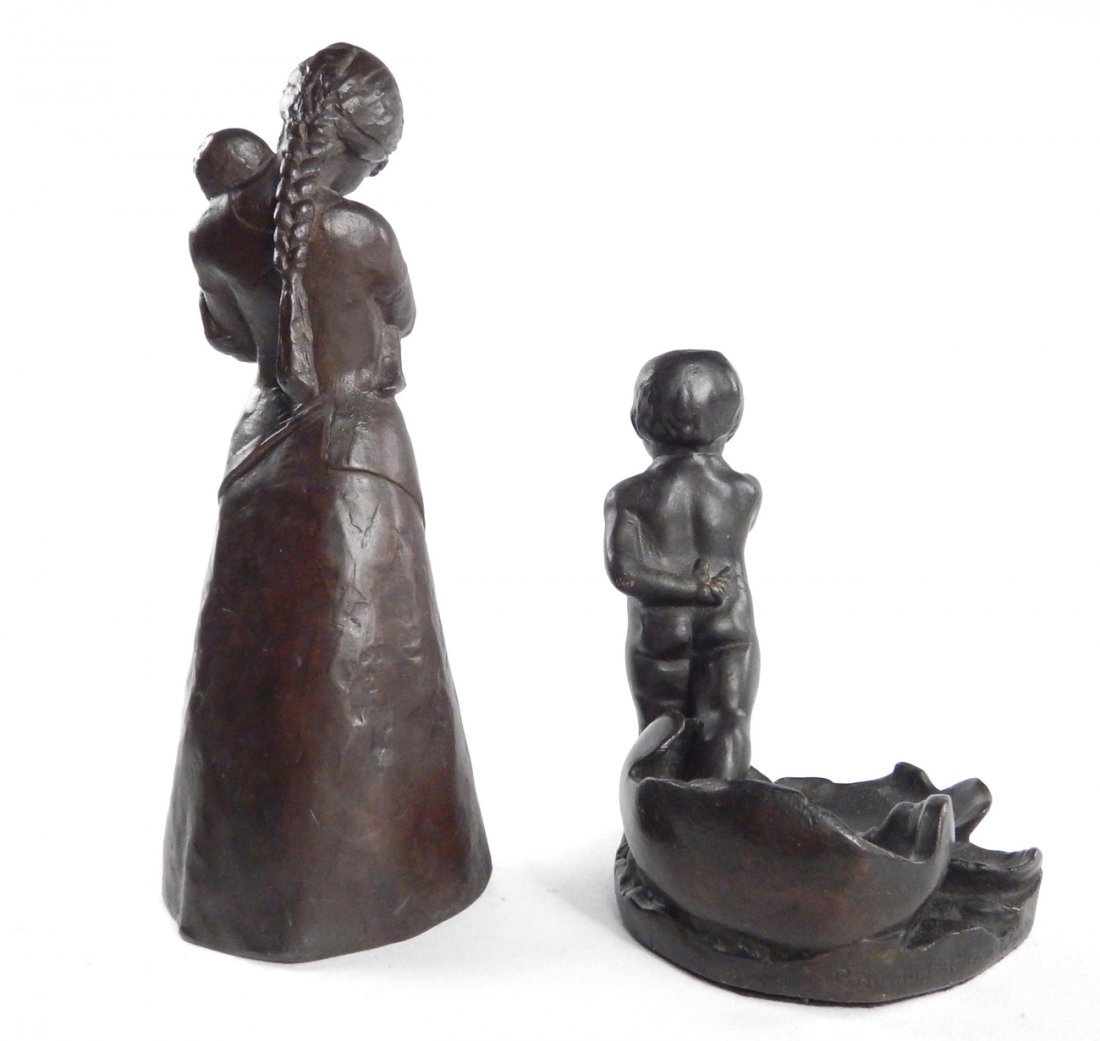 Two Figural Bronzes: Comprises: 1.) Boy with whistle emerging from eggshell (Roman Bronze Works). 2.) Mother and child, inscribed 'Kelsey' with other marks at hip area. [Mother and child: 3 1/4" W x 3" D x 8 1/2" H].